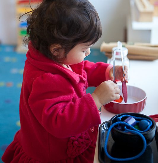 Children learning in a Montessori classroom at Casa dei Bambini